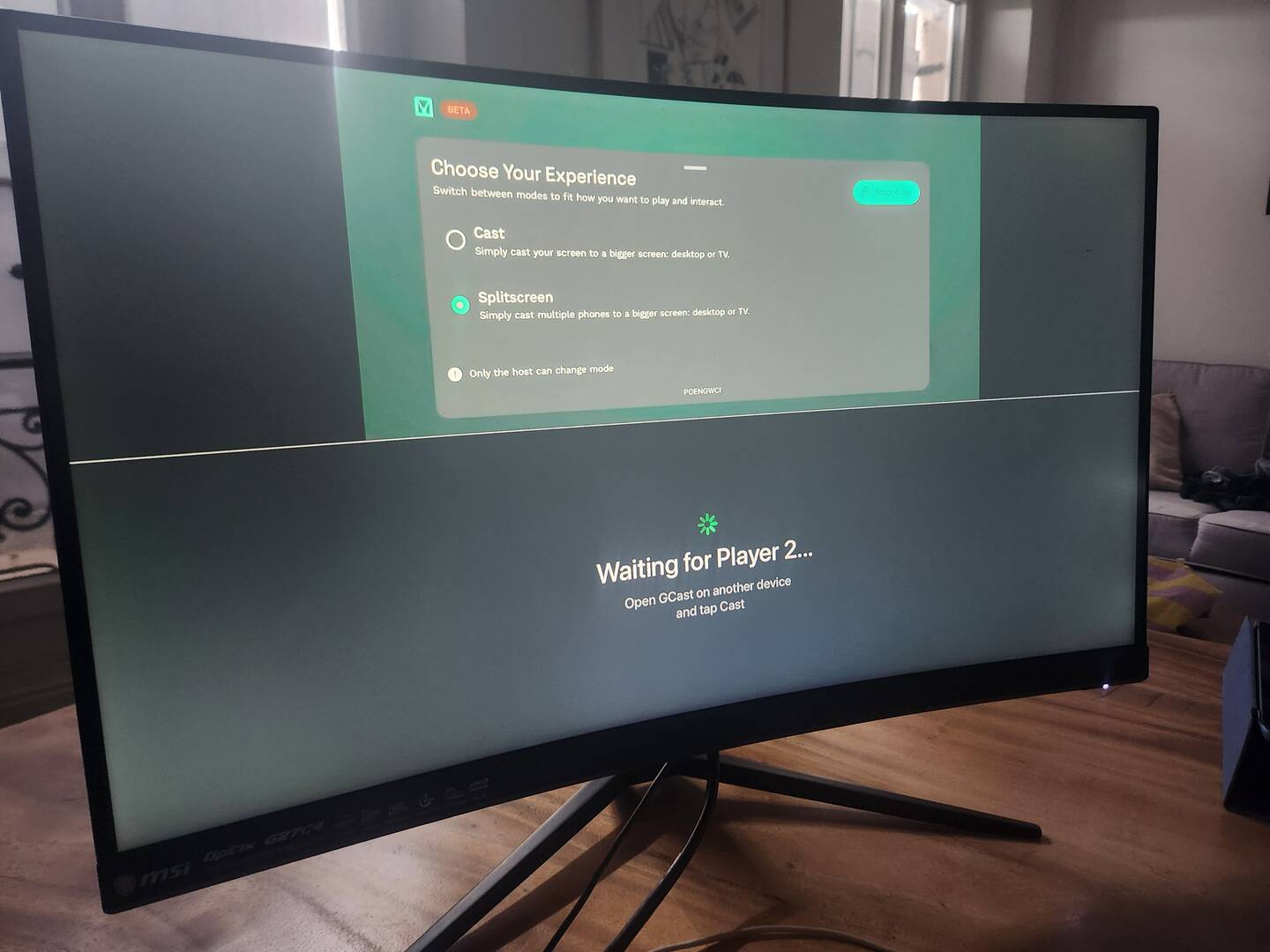 A screen displaying the GCast split screen with a Waiting for Player 2 prompt